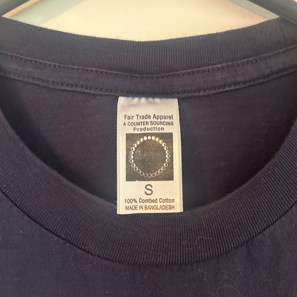 Uconn fair trade peace sign shirt